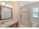 Clean bathroom with granite countertop and walk-in shower at 1833 Sandalwood Dr, Sarasota, FL 34231
