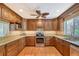 Bright kitchen with wood cabinets and granite counters at 1833 Sandalwood Dr, Sarasota, FL 34231
