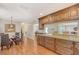 Spacious kitchen with granite countertops and wooden cabinetry at 1833 Sandalwood Dr, Sarasota, FL 34231