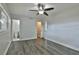 Spacious bedroom featuring wood floors and access to closet and bathroom at 2912 Pinecrest Way, Sarasota, FL 34239