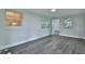 Bright bedroom with new flooring, multiple windows, and neutral walls, providing a serene atmosphere at 2912 Pinecrest Way, Sarasota, FL 34239