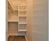 Walk-in closet with custom shelving at 2912 Pinecrest Way, Sarasota, FL 34239