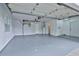 Clean and spacious garage with sealed floors, ready for parking and storage at 2912 Pinecrest Way, Sarasota, FL 34239