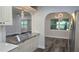 Bright kitchen with stainless steel appliances and ample counter space, ideal for cooking and entertaining at 2912 Pinecrest Way, Sarasota, FL 34239