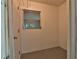 Mud room with a window and door is well-lit, offering easy access and convenience at 2912 Pinecrest Way, Sarasota, FL 34239