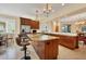 Beautiful eat-in kitchen featuring granite countertops, wood cabinets, and stainless steel appliances at 7620 Club Ln, Sarasota, FL 34238