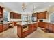 Spacious kitchen featuring a kitchen island, stainless steel appliances, and granite countertops at 7620 Club Ln, Sarasota, FL 34238