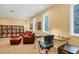 Spacious living room with comfortable seating, large windows, and built-in shelving for storage and display at 7620 Club Ln, Sarasota, FL 34238