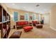 Expansive living room with a variety of seating options, natural light, and a comfortable atmosphere at 7620 Club Ln, Sarasota, FL 34238