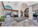Grand lobby with high ceilings, chandelier, stone floors, and elegant reception area at 7620 Club Ln, Sarasota, FL 34238