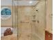 Elegant shower with glass door, offering a luxurious bathing experience with custom tile work and upscale fixtures at 7620 Club Ln, Sarasota, FL 34238