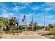 Tranquil memorial plaza with flags and paved walkways at 929 Suncrest Ln, Englewood, FL 34223