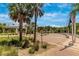 Park entrance with palm trees, benches, and lush landscaping at 929 Suncrest Ln, Englewood, FL 34223