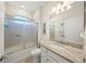 Clean bathroom with granite countertop and a tub/shower combo at 19369 Nearpoint Dr, Venice, FL 34292