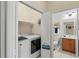 Convenient laundry room with washer, dryer, and extra shelving at 9035 Stone Harbour Loop, Bradenton, FL 34212