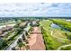 Aerial view showing community, golf course, and homes at 9035 Stone Harbour Loop, Bradenton, FL 34212