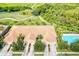 Aerial view of home with pool and golf course views at 9035 Stone Harbour Loop, Bradenton, FL 34212