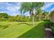 Landscaped backyard with lush lawn at 9035 Stone Harbour Loop, Bradenton, FL 34212