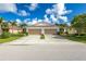 Two-story attached homes with two-car garages and landscaped yards at 8798 Tuscany Isles Dr, Punta Gorda, FL 33950