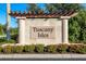 Tuscan Isles community entrance with a stone sign and landscaping at 8798 Tuscany Isles Dr, Punta Gorda, FL 33950