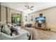 Cozy living room featuring a comfy sofa and large TV at 8798 Tuscany Isles Dr, Punta Gorda, FL 33950