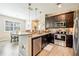 Modern kitchen with stainless steel appliances and granite countertops at 8798 Tuscany Isles Dr, Punta Gorda, FL 33950