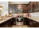 Modern kitchen with stainless steel appliances and granite countertops at 8798 Tuscany Isles Dr, Punta Gorda, FL 33950