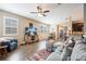 Open living room with tile floors, sofa, and views into dining area and kitchen at 8798 Tuscany Isles Dr, Punta Gorda, FL 33950