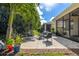 Spacious backyard patio with seating area and landscaping at 8798 Tuscany Isles Dr, Punta Gorda, FL 33950