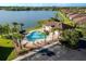 Community pool with a clubhouse and lake view at 8798 Tuscany Isles Dr, Punta Gorda, FL 33950
