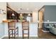 Modern kitchen with island, stainless steel appliances, and granite countertops at 8798 Tuscany Isles Dr, Punta Gorda, FL 33950