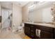 Double vanity bathroom with granite countertops and a shower at 8798 Tuscany Isles Dr, Punta Gorda, FL 33950