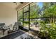 Bright and airy screened porch with view of backyard patio at 8798 Tuscany Isles Dr, Punta Gorda, FL 33950