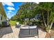 Outdoor patio area with fire pit and comfortable seating at 8798 Tuscany Isles Dr, Punta Gorda, FL 33950