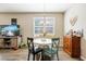 Dining area with white table and chairs, near kitchen and living room at 8798 Tuscany Isles Dr, Punta Gorda, FL 33950