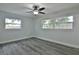 Well-lit bedroom featuring wood-look floors and ceiling fan at 2912 Pinecrest Way, Sarasota, FL 34239