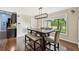Dining area with a farmhouse table and bench seating at 6106 45Th W St, Bradenton, FL 34210