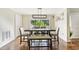 Dining room with table and seating for six, and a view of the backyard at 6106 45Th W St, Bradenton, FL 34210