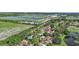 Community overview featuring houses near a golf course and lake at 6106 45Th W St, Bradenton, FL 34210