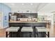 Kitchen island with seating for three and granite countertop at 6106 45Th W St, Bradenton, FL 34210