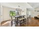 Bright dining room features a wood table with seating for six and a view to the backyard at 6106 45Th W St, Bradenton, FL 34210