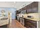 Modern kitchen with stainless steel appliances and granite countertops at 6106 45Th W St, Bradenton, FL 34210
