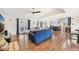 Spacious living room with hardwood floors, comfortable seating, and large TV at 6106 45Th W St, Bradenton, FL 34210