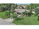 Attractive single-Gathering home with a large grassy yard and palm trees at 6106 45Th W St, Bradenton, FL 34210