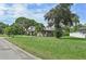 House exterior view from the street, showing a large yard at 6106 45Th W St, Bradenton, FL 34210