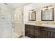 Elegant bathroom with double sinks, a large shower, and modern fixtures at 6106 45Th W St, Bradenton, FL 34210