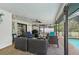 Relaxing covered patio with seating area and pool access at 6106 45Th W St, Bradenton, FL 34210