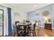 Charming dining area with a round table and four chairs, adjacent to a daybed at 6106 45Th W St, Bradenton, FL 34210