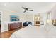 Bright main bedroom with king-size bed, dresser, and en-suite bathroom access at 6106 45Th W St, Bradenton, FL 34210