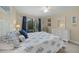 Spacious bedroom with a queen bed and private balcony access at 6503 Mourning Dove Dr # 224, Bradenton, FL 34210